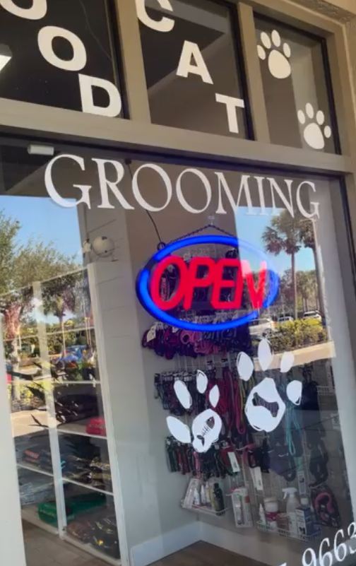 Clean storefront glass at a pet grooming shop
