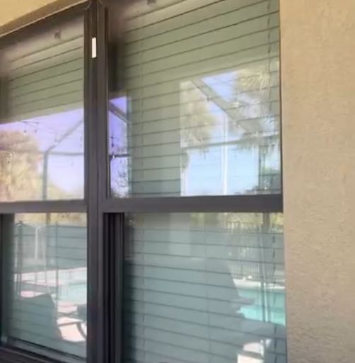 Clean pool cage and lanai enclosure glass